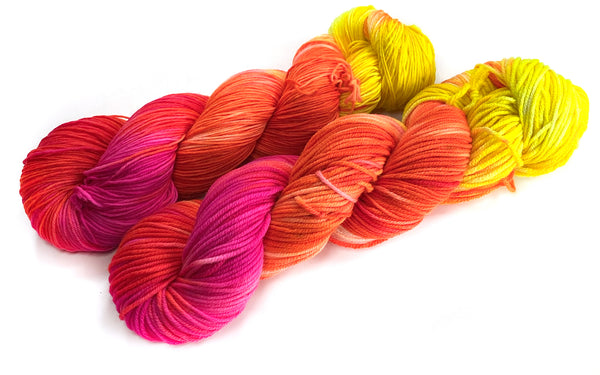 hand dyed wool yarn magenta orange yellow neon decloaking star trek themed colors for knitting and crochet