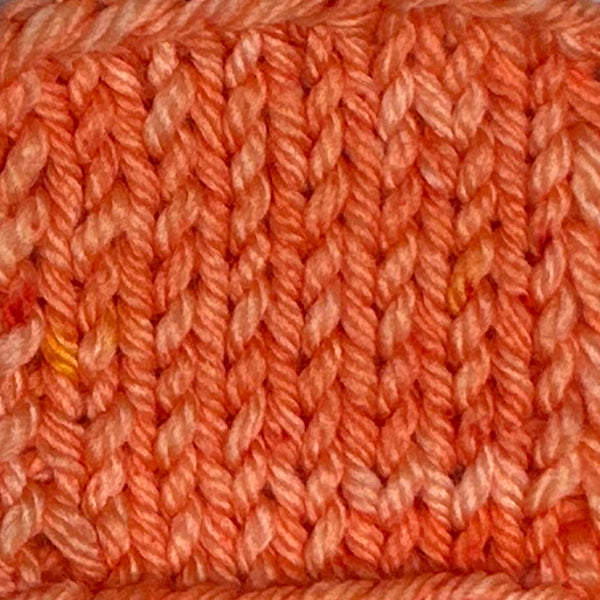Coral orange colored hand dyed yarn for knitting and crochet in different yarn types and skein sizes