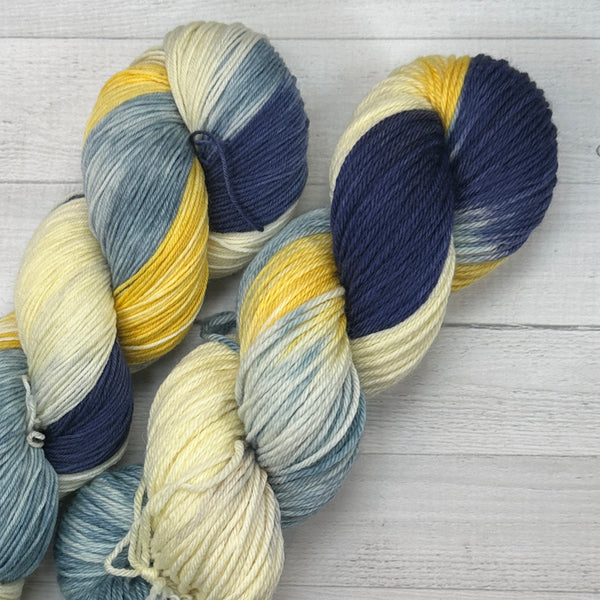 navy, blue, yellow, and cream hand dyed yarn for knitting and crochet from the mixtape collection
