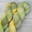 greens and yellow hand dyed yarn for knitting and crochet from the mixtape song collection who'll stand with us