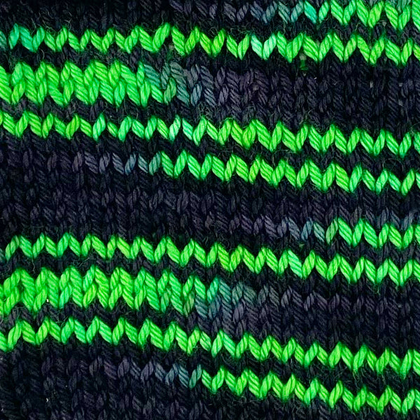 hand dyed wool yarn black and neon decloaking star trek themed knitting swatch