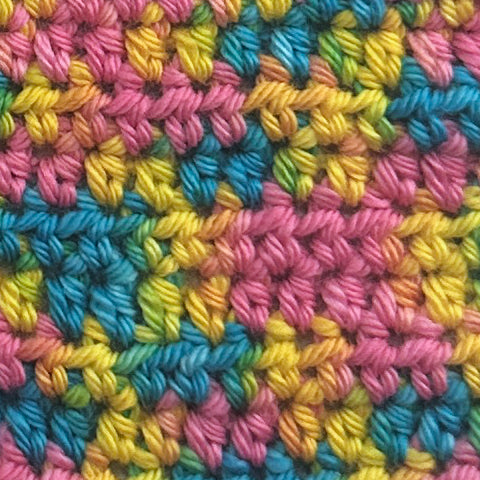  crochet swatch of Hand dyed yarn in pink and yellow, and turquoise mixtape music colorway starman on wool yarn fingering, dk, worsted, and bulky