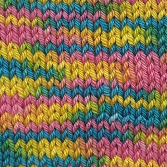  knit swatch in Hand dyed yarn in pink and yellow, and turquoise mixtape music colorway starman on wool yarn fingering, dk, worsted, and bulky